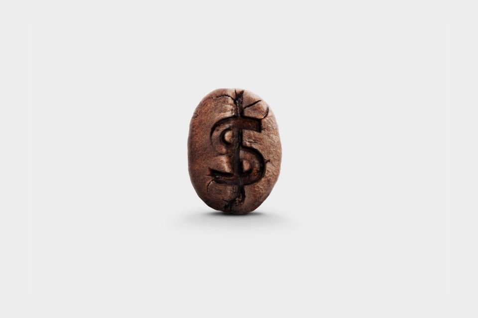Kaffeebohne mit Dollarzeichen