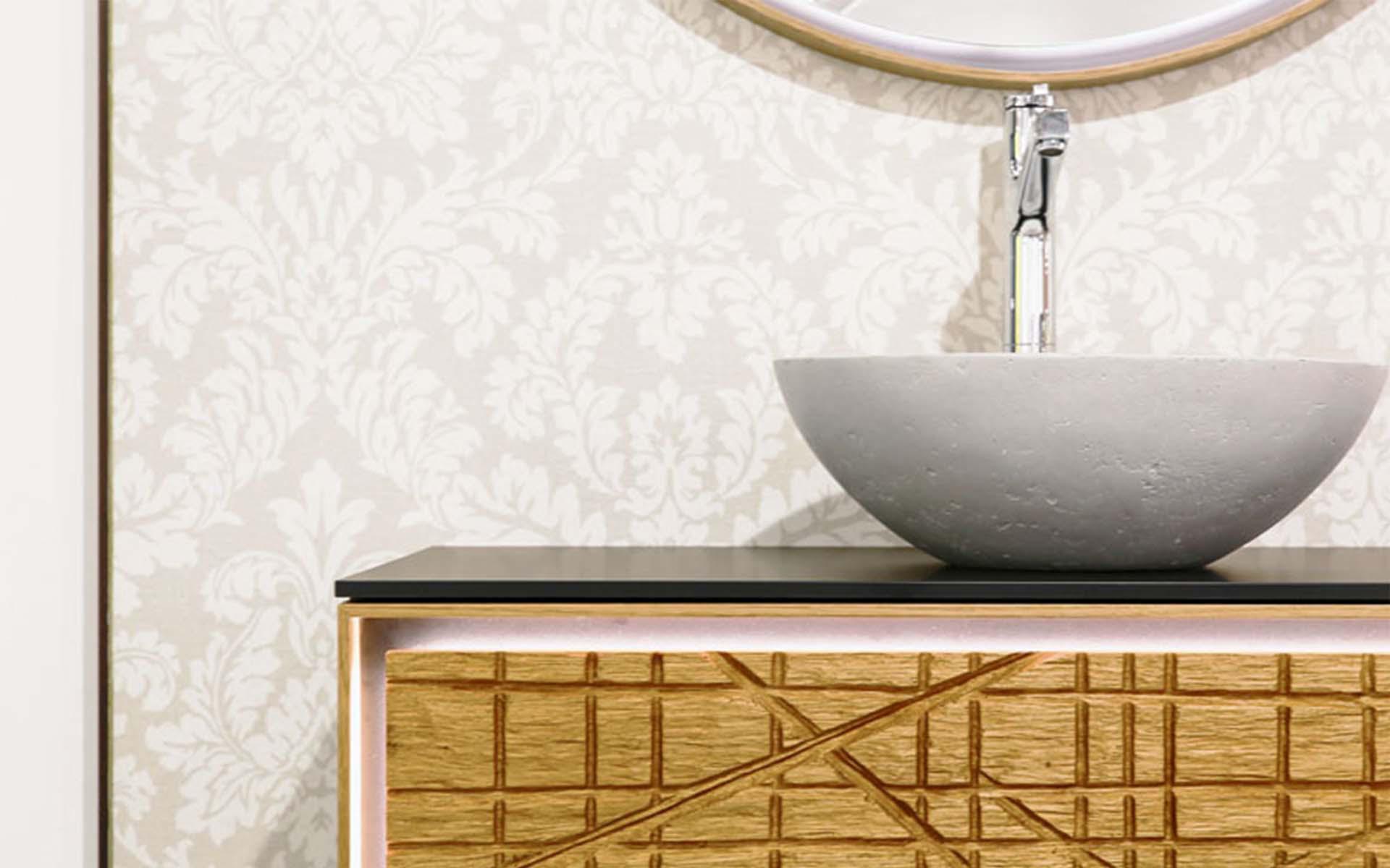 Il programma di mobili «Arteko» è il connubio di un linguaggio di design indipendente e dell'abilità artigiana. Il frontale in legno massiccio è stato realizzato con una motosega. Foto: Loosli